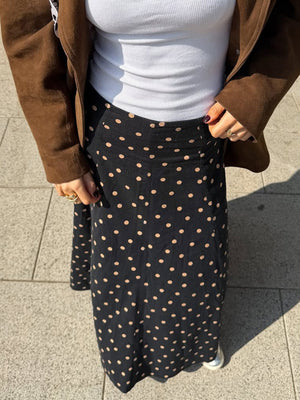 tan A-line skirt featuring high-waisted and polka dot