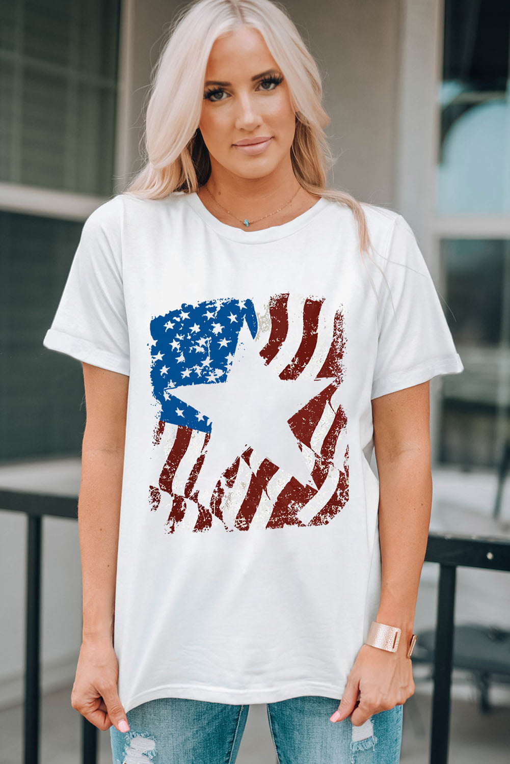 White round neck t-shirt with distressed American flag graphic and white star.