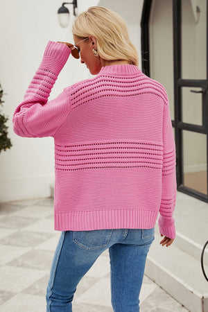 Pink open-knit mock neck sweater with horizontal open-knit details on back and sleeves.