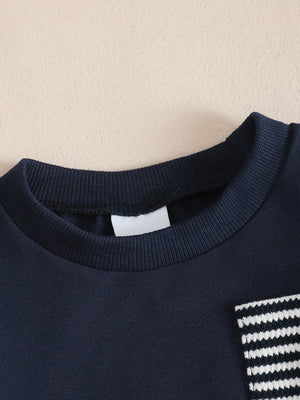 Children's navy cotton sweatshirt with striped pocket detail