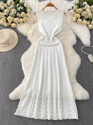 White knit midi dress with textured pattern and cutout details