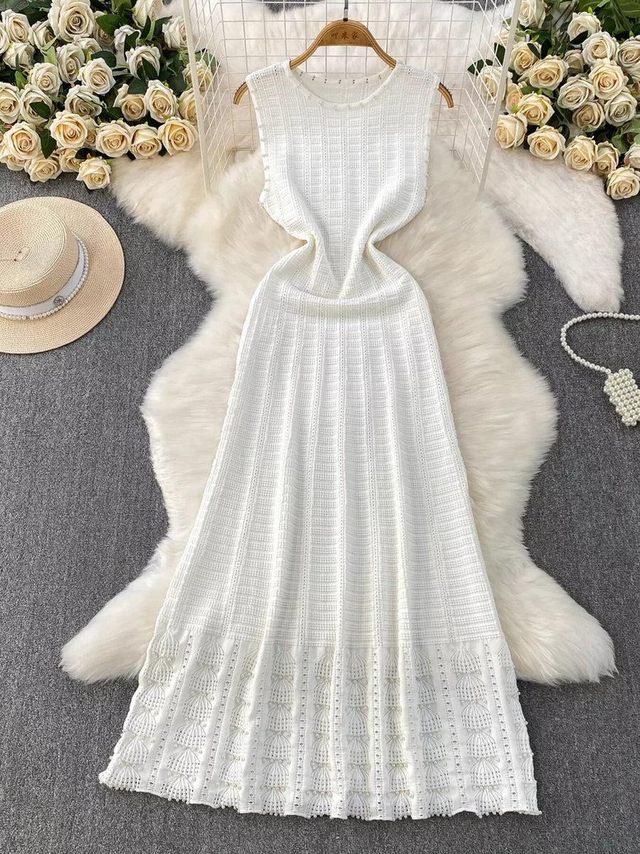 White knit midi dress with textured pattern and cutout details