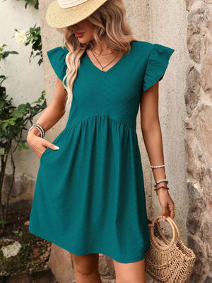 Teal A-line dress with ruffled short sleeves, V-neck, and textured fabric.