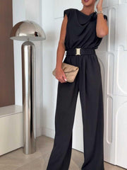 Black wide-leg jumpsuit with cowl neck, sleeveless design, and gold buckle belt.
