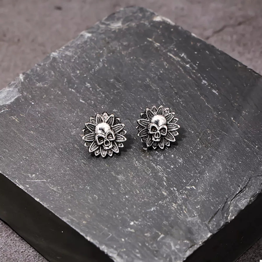 Black ACCESSORIES featuring stud earring and skull-sunflower motif