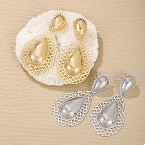earrings in gold featuring hollowed-out and teardrop fit