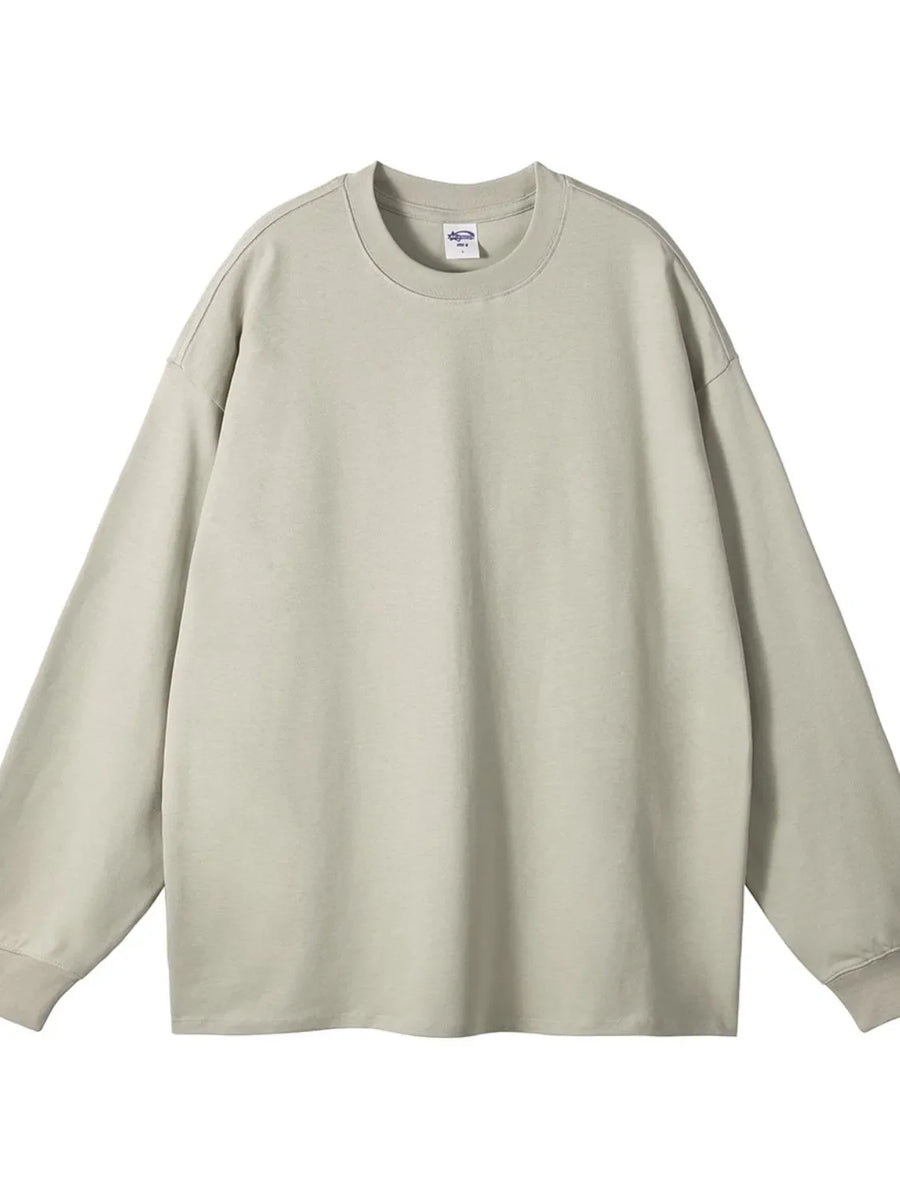 Oversized drop-shoulder crewneck pullover in beige, 100% cotton, long sleeve sweatshirt.