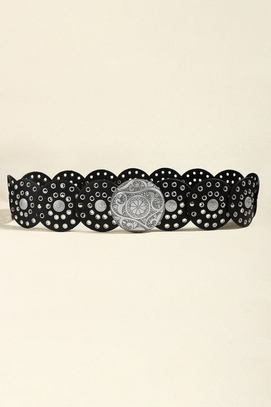Black belt with silver disc embellishments and a large ornate silver buckle.