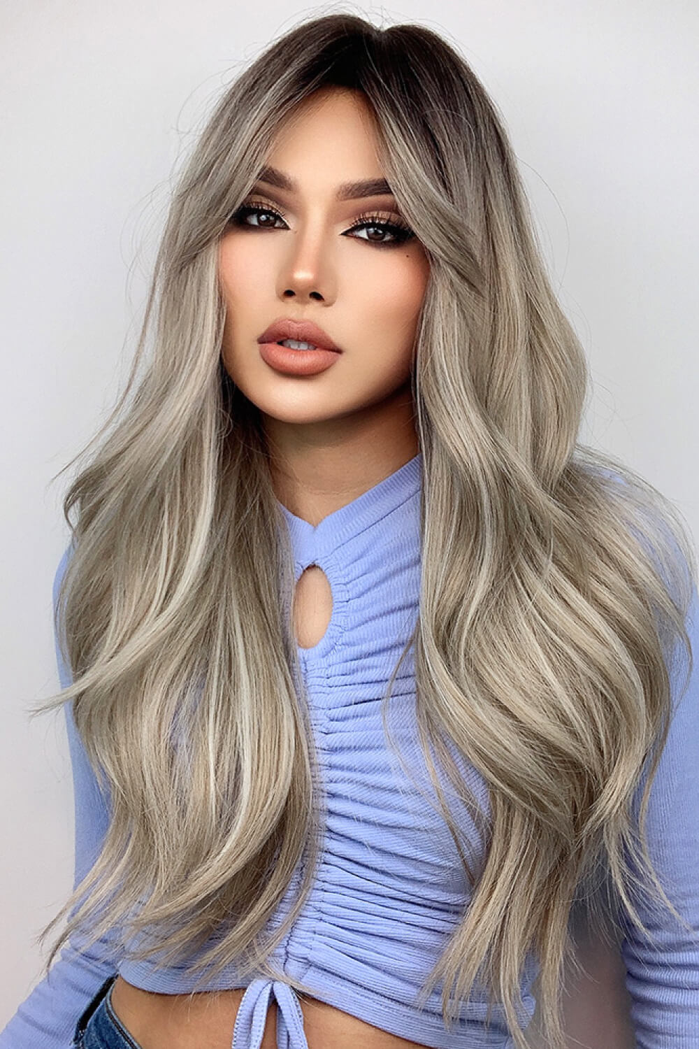 Ombre Wave Frontal Wig in Ash Blonde Balayage with dark roots and loose waves.