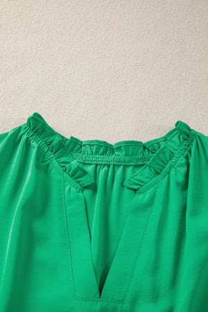 Green maxi dress with ruffled neckline and V-neck detail