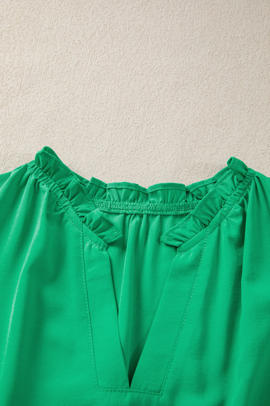 Green maxi dress with ruffled neckline and V-neck detail