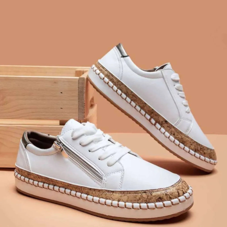 White zip-up sneakers with cork sole detail and laces