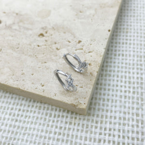 Silver earrings featuring star motif and star