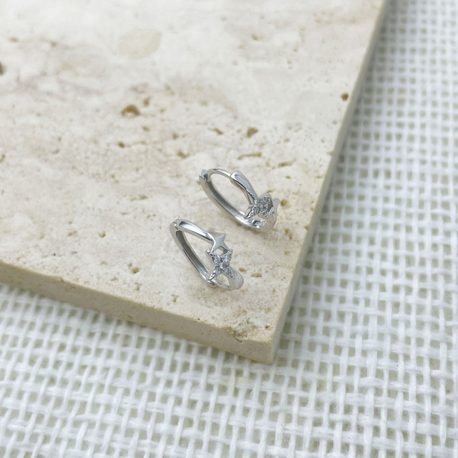 Silver earrings featuring star motif and star