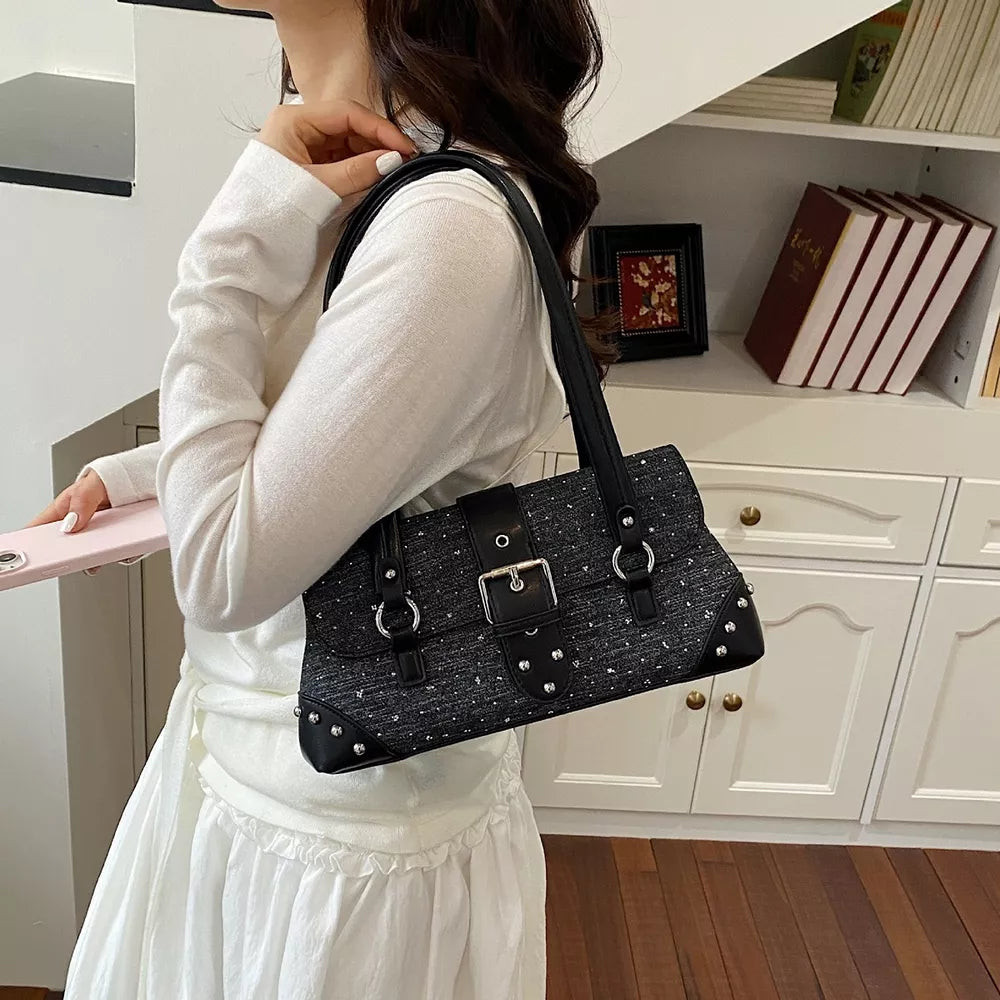 handbag in black featuring studded and boxy fit