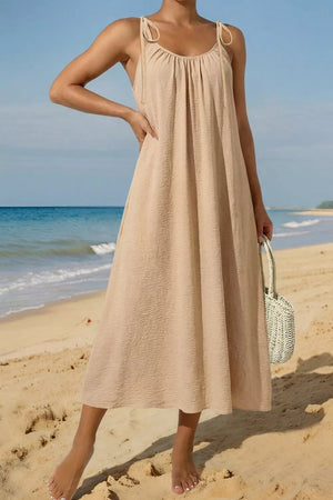 Beige cotton blend midi dress with tie shoulders and textured fabric.