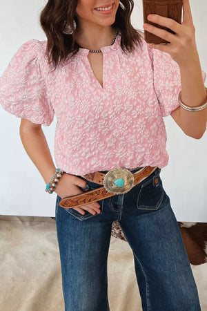 Textured floral puff sleeve maternity shirt in blush pink with a V-neck and short sleeves.
