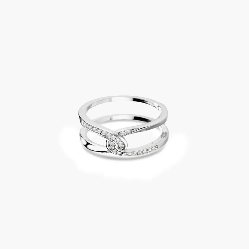 Silver band ring with intertwined design and pavé crystal details