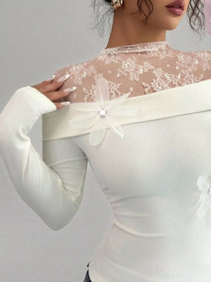White lace detail long-sleeve bodysuit with off-the-shoulder neckline and floral embellishments.