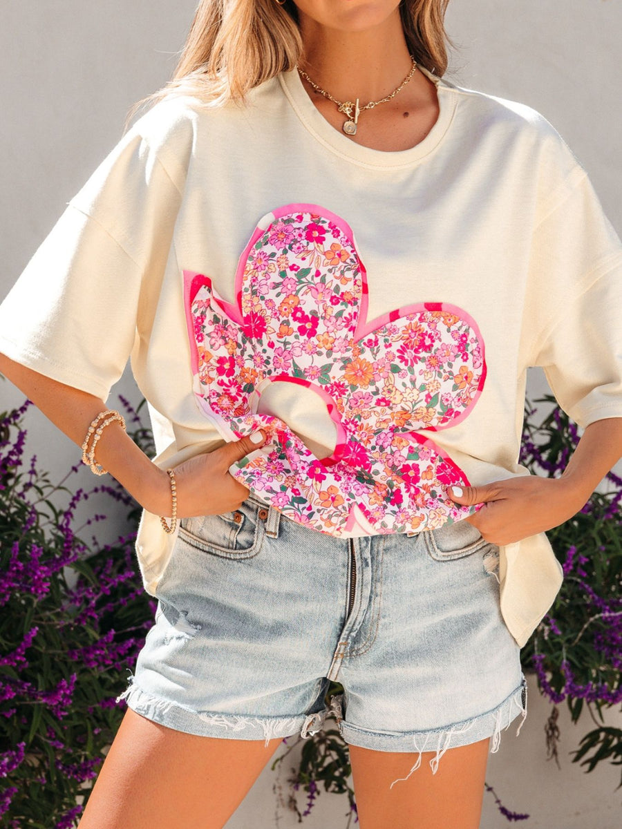Cream cotton crew neck t-shirt with oversized floral chenille patch and pink trim