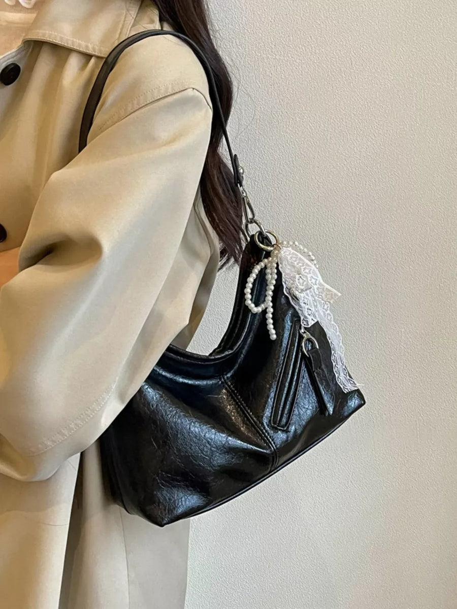 black with handbag with exterior zip pocket