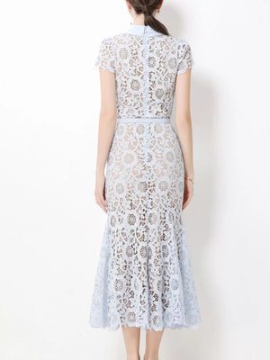 Light blue lace midi dress with cap sleeves, collar, and studded belt detail.
