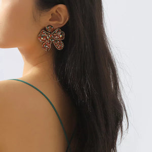 earrings in red featuring beaded and bowknot fit