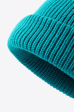 Teal ribbed knit beanie with folded edge detail