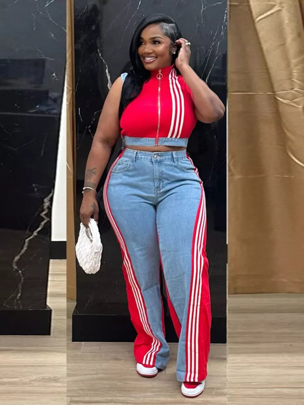 Red zip-front crop top with white stripes and wide-leg pants with red and white side stripes.