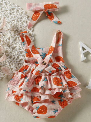 Baby bodysuit with strawberry print, ruffled skirt, and matching headband.