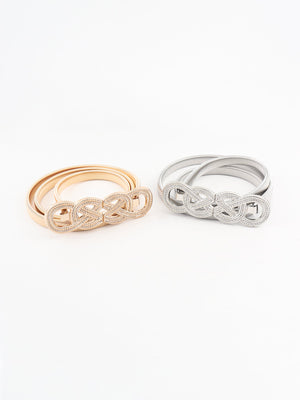 Gold and silver elastic waist belts with intertwined knot detail