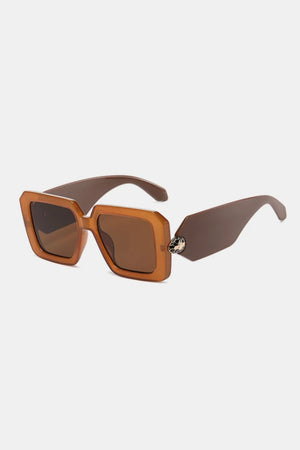 Geometric facet sunglasses in brown with embellished detail.