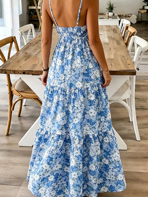 Floral tiered maxi dress with spaghetti straps in Sky Blue, featuring a smocked bodice and ruffled hem.