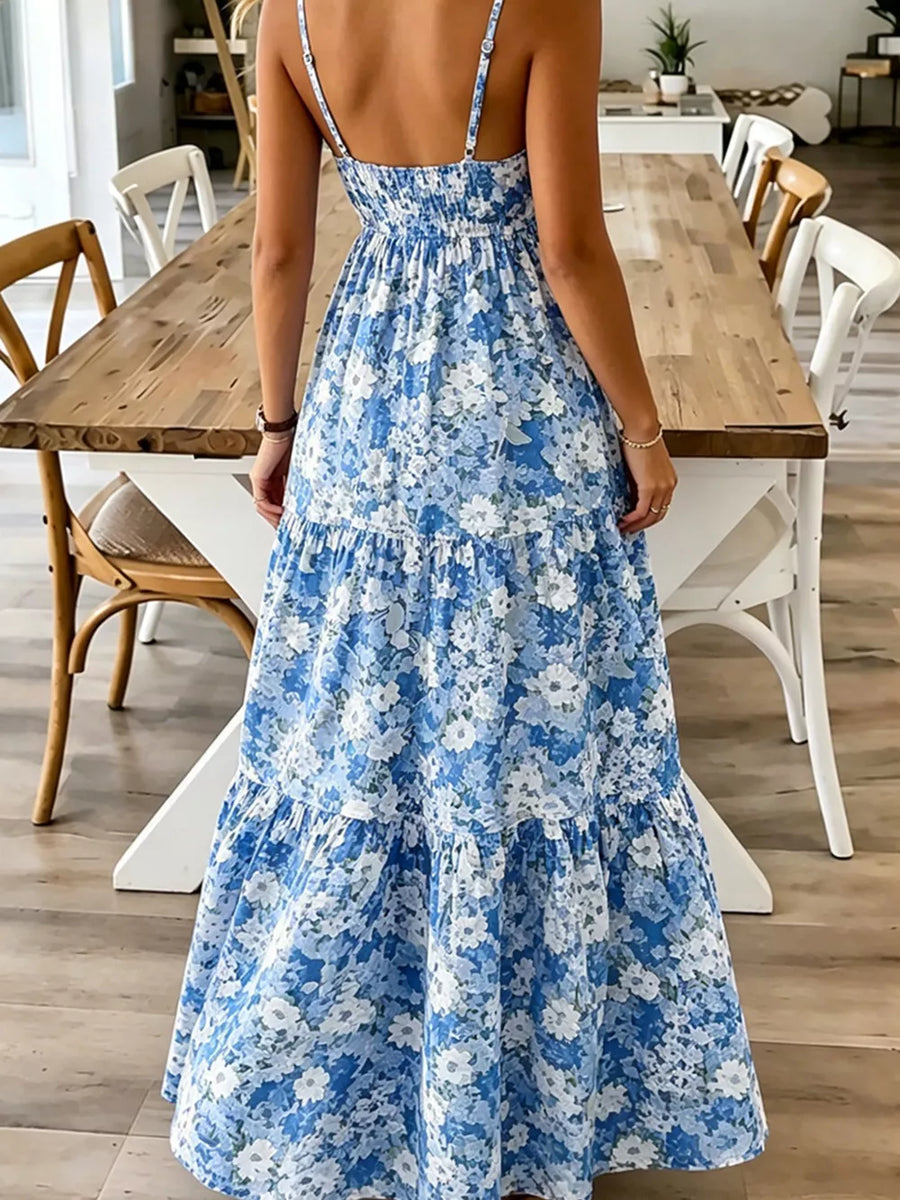 Floral tiered maxi dress with spaghetti straps in Sky Blue, featuring a smocked bodice and ruffled hem.