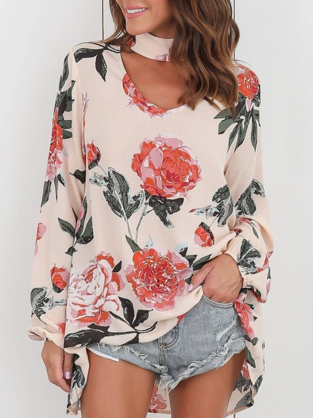 light pink blouse with floral and v-neck