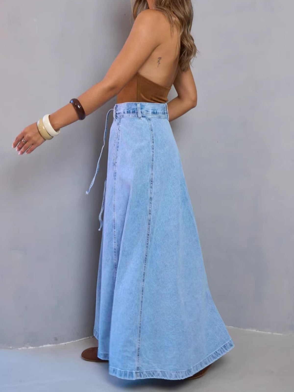 Light blue denim maxi skirt with a-line cut and high waist