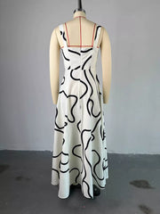 White midi dress with abstract black pattern, square neck, and thin straps.