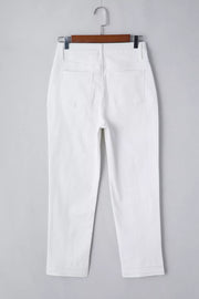 White cotton high-waisted straight leg jeans with ankle length and folded hem detail.