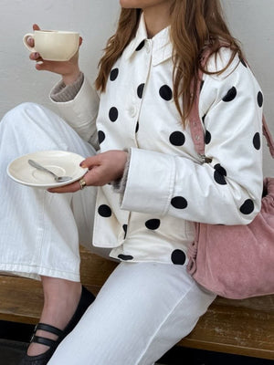 white jacket with hip-length and button-front