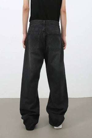Black wide leg denim jeans with a relaxed fit and classic five-pocket styling.