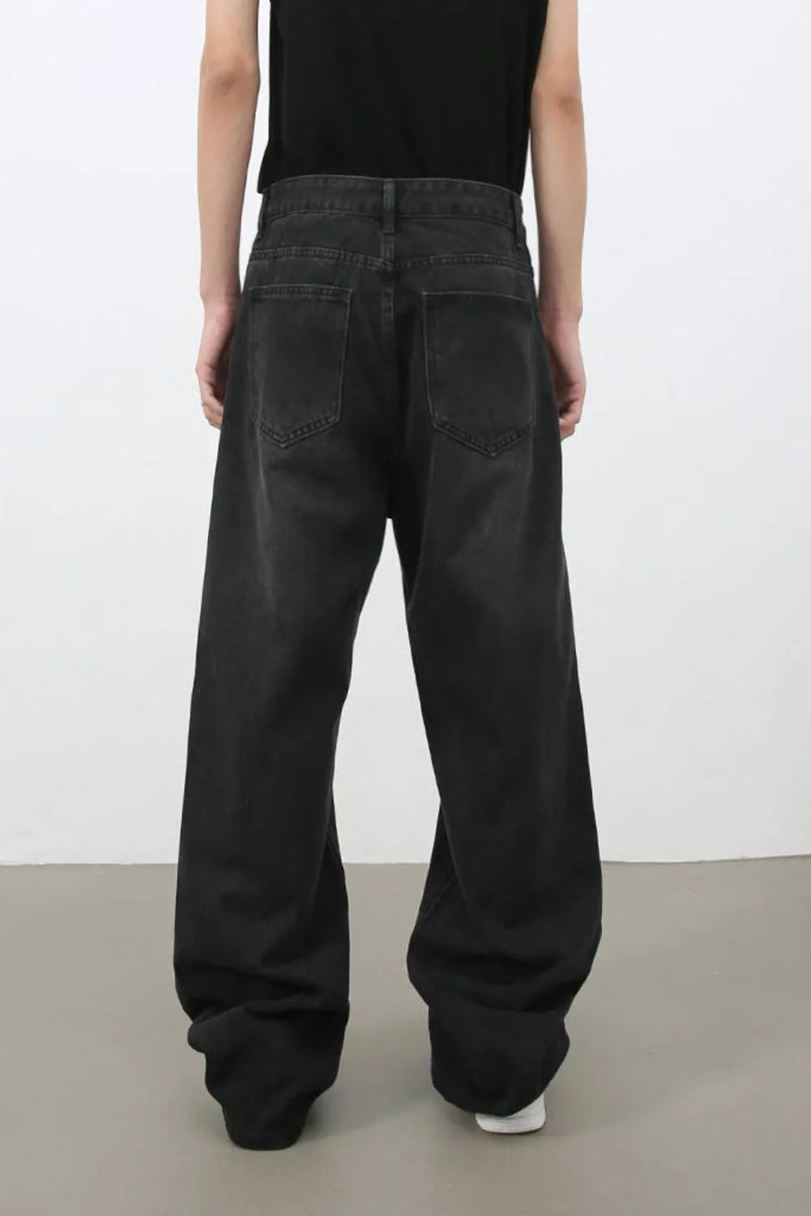 Black wide leg denim jeans with a relaxed fit and classic five-pocket styling.
