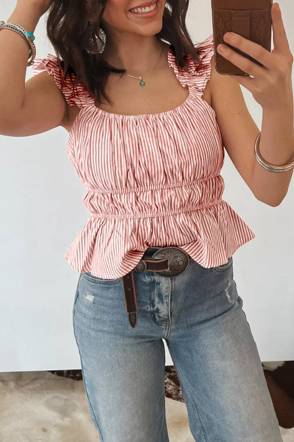 Striped ruffle sleeve peplum blouse with smocked waist and square neckline.