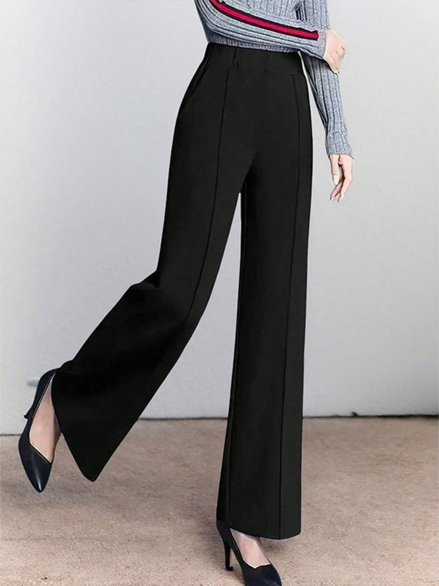 Black high-waisted wide leg cotton trousers with pockets and a clean seam detail.