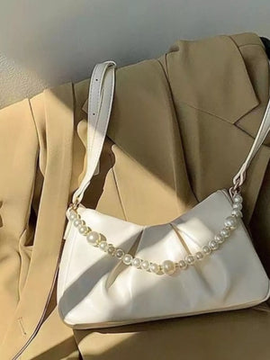 Pearl ruched shoulder bag in white with a pearl strap detail.