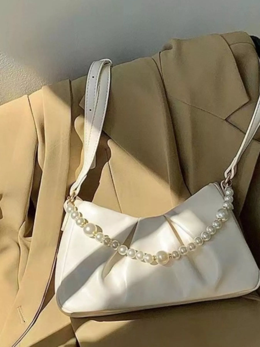Pearl ruched shoulder bag in white with a pearl strap detail.