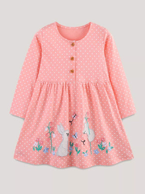 Girls pink polka dot dress with bunny and flower embroidery.