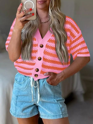 Pink and orange striped knit cropped cardigan with buttons and short sleeves.