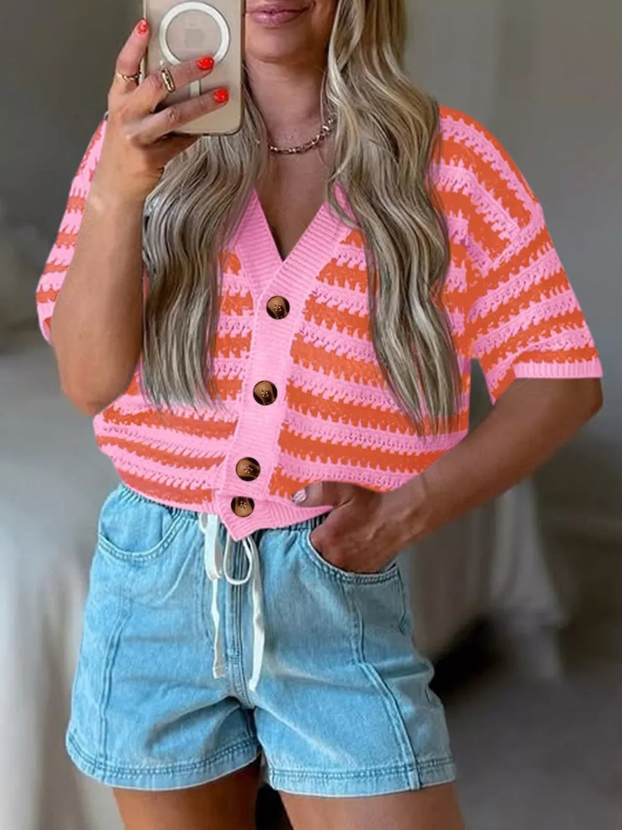 Pink and orange striped knit cropped cardigan with buttons and short sleeves.