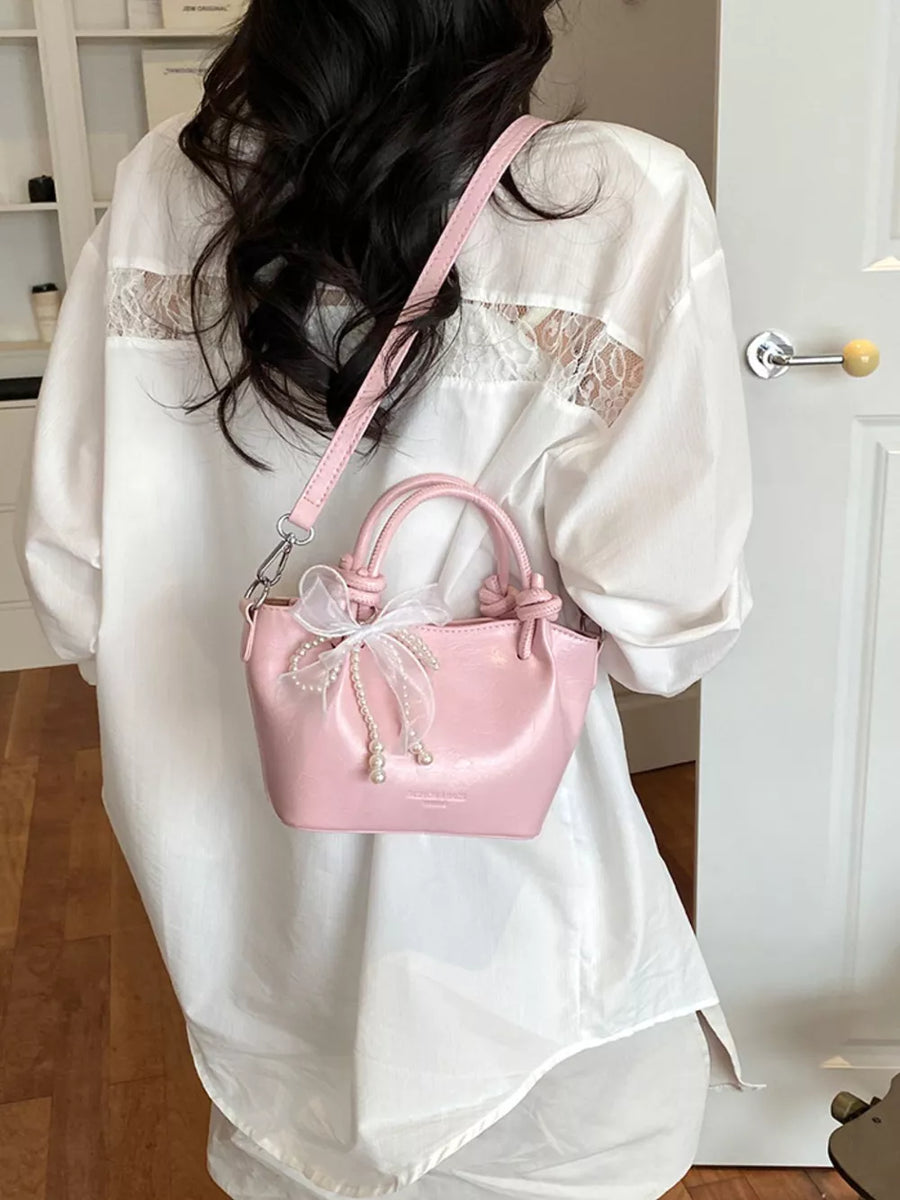 crossbody bag in light pink with bowknot and mini