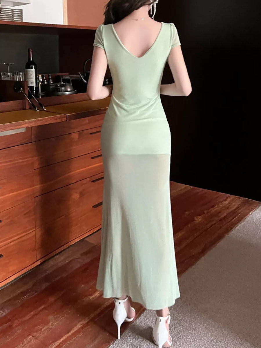 Light green surplice ruffle maxi dress with short sleeves and V-neck.